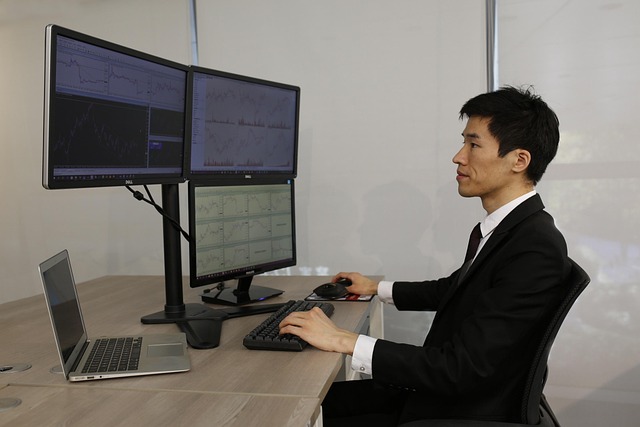 trader experiencing stress and anxiety while analyzing financial charts on digital screens